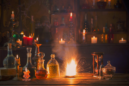 magic potions in bottles on wooden background