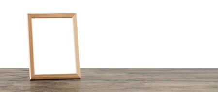 wooden frame on wooden table on white backgroundの写真素材