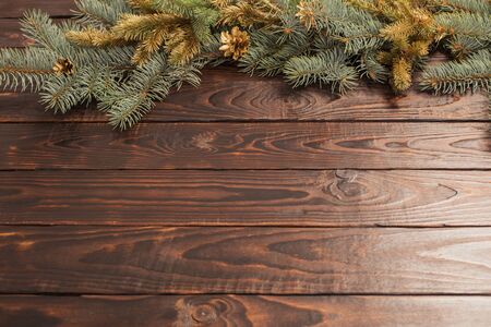 Christmas fir branches  on old dark wooden backgroundの写真素材