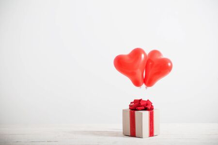 heart shaped red balloons on white backgroundの写真素材