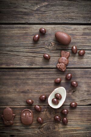 chocolate Easter eggs on dark wooden backgroundの写真素材