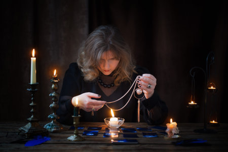 mature woman guessing with cards on dark background