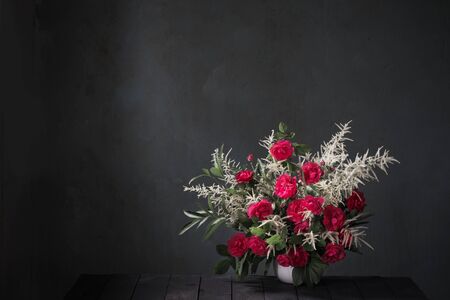bouquet of red roses on background black wallの写真素材