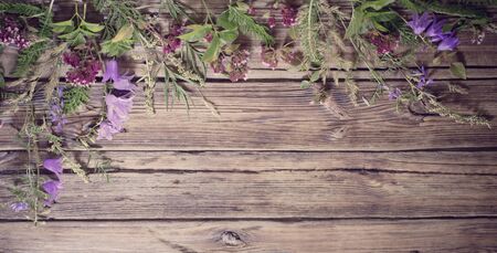 wildflowers on dark old wooden backgroundの写真素材