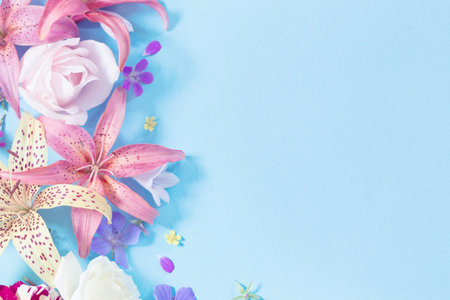 frame of beautiful garden flowers on paper background