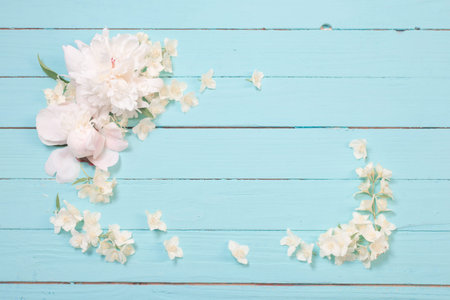 white flowers on white wooden background