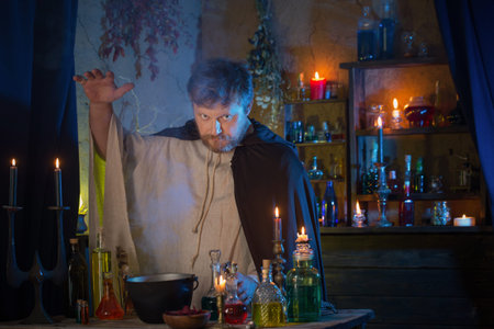 portrait of wizard with burning candles and magic potions