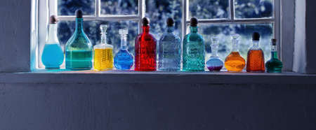 magic potions in bottles on windowsillの写真素材