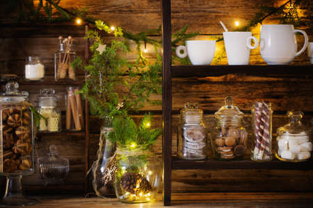 Christmas decoration cocoa bar with cookies and sweets on old wooden background in natural rustic style. Winter cozy conceptの写真素材