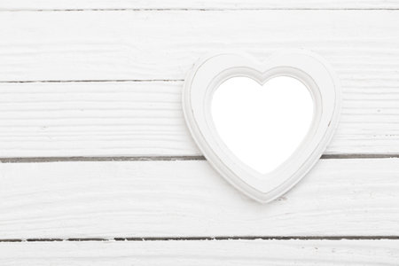 old white wooden frame on white wooden backgroundの写真素材