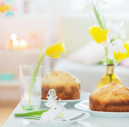 Easter cakes with spring flowers in white interiorの写真素材