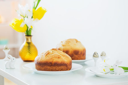 Easter cakes with spring flowers in white interior