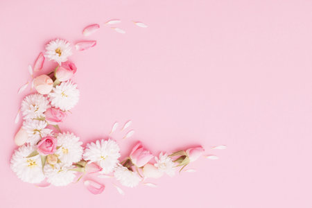 pink and white flowers on pink paper backgroundの写真素材