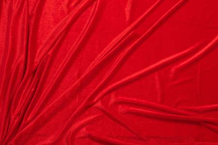 background of red corduroy with foldsの写真素材