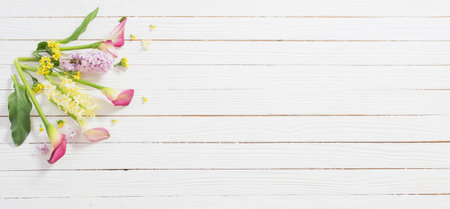 beautiful flowers on white wooden backgroundの写真素材