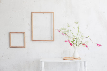 flowers in vase on background white wall