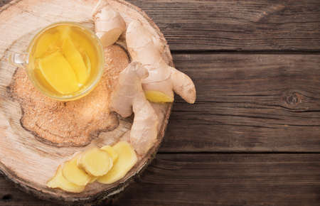 ginger tea on old wooden backgroundの写真素材
