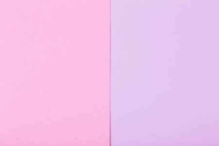 background of pink and violet pastel sheets of paperの写真素材