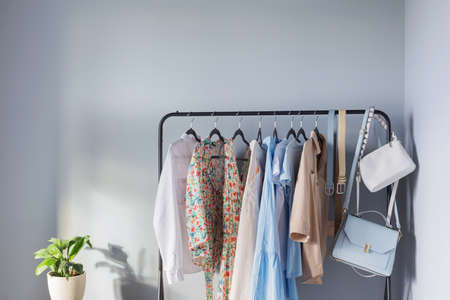 light colored womens summer clothes on hangerの写真素材