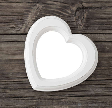 old white wooden frame on wooden tableの写真素材