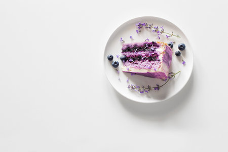 blueberry lavender cheesecake on plate on white table
