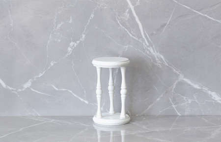 white vintage old podiun on gray marble backgroundの写真素材