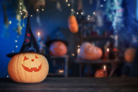 Halloween pumpkins on old wooden table on background Halloween decorationsの写真素材