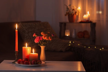 autumn decorations with burning candles at homeの写真素材