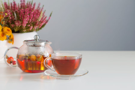 rosehip tea on white table in kitchen