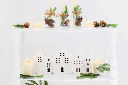 home christmas decor with burning candles in whte interiorの写真素材