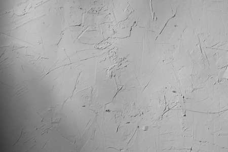 old background of white cement surface with cracksの写真素材