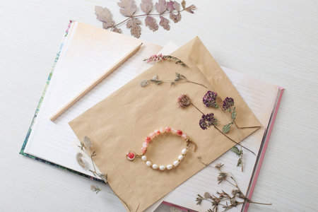 vintage composition of dried plants and old sheets of paper