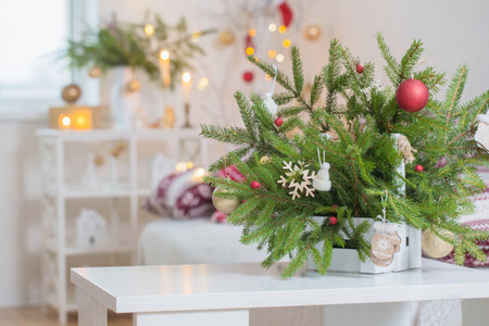 christmas home decorations with candles in red and white colorsの写真素材