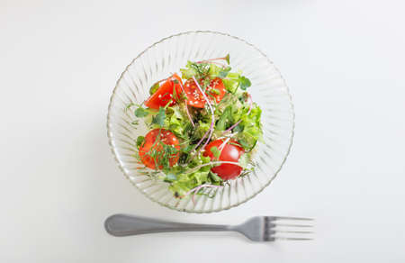 healthy vegetarian salad on white tableの写真素材