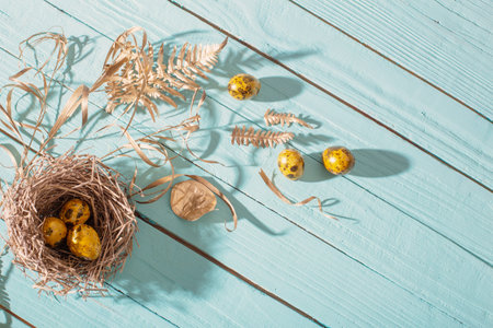 easter golden eggs on old blue wooden backgroundの写真素材