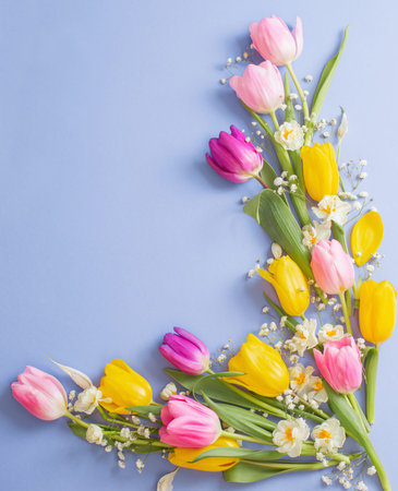 spring flowers on blue paper background