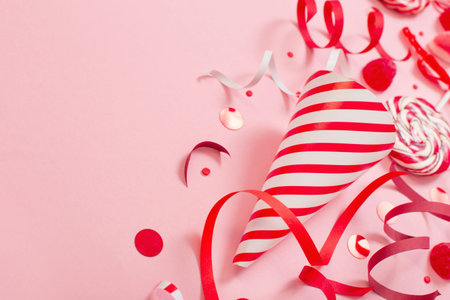 birthday background with red and pink paper birthday decotationsの写真素材