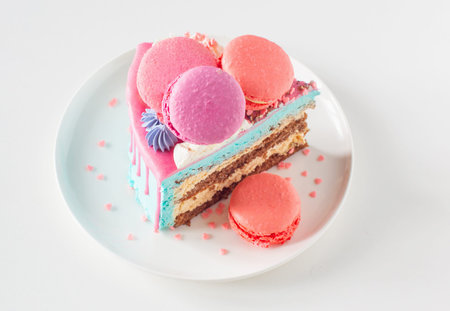 piece of cake with pink and blue decor on white plate