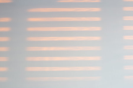 wall with window shadows at sunset