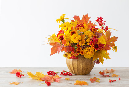 autumnal bouquet in ceramic vase on white backgroundの写真素材