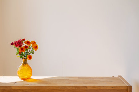 chrysanthemums in glass vase on white backgroundの写真素材