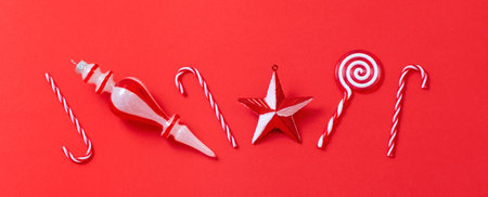 white and red christmas decorations on red backgroundの写真素材