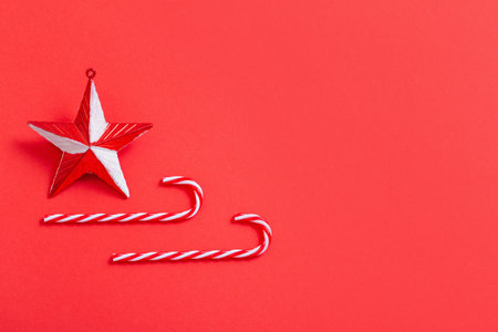 white and red christmas decorations on red backgroundの写真素材