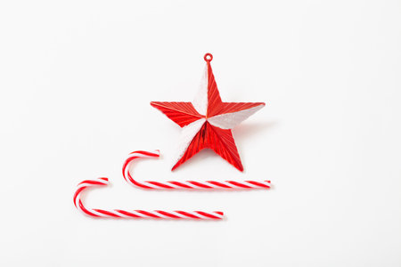 white and red christmas decorations on white background