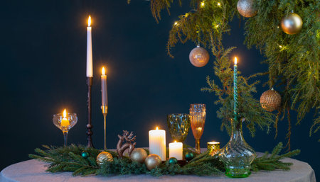 green and golden christmas decor on table on dark backgroundの写真素材