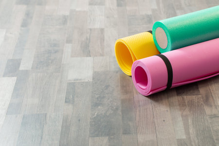 fitness mat on wooden floor at home