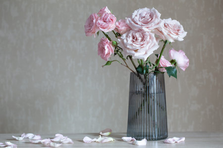 still life with pink roses in glass vaseの写真素材
