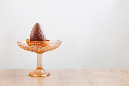 chocolate easter egg on plate on white backgroundの写真素材