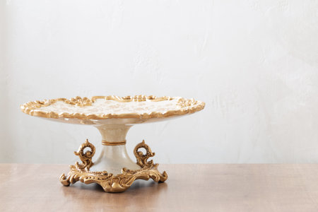 clean vintage big cake plate on wooden tableの写真素材