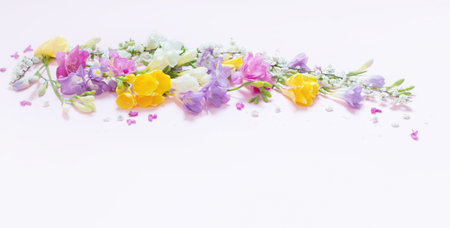 spring flowers on pastel pink background